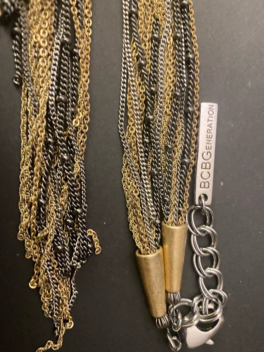 BCBGeneration Multi Tone
Knotted Metal Chain
Multi-Strand Tassel Necklace
18”